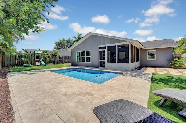 18428 Alydar Way, Boca Raton, FL 33496 - view of pool with a sunroom, a patio area, and a playground
