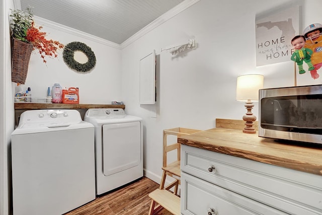 18428 Alydar Way, Boca Raton, FL 33496 - washroom featuring washing machine and clothes dryer, crown molding, and wood finished floors