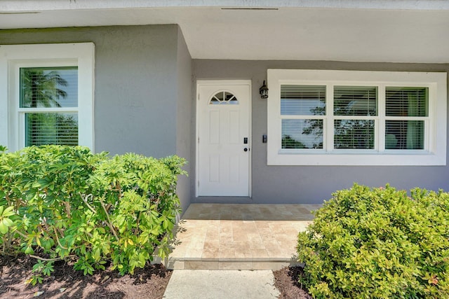 18428 Alydar Way, Boca Raton, FL 33496 - doorway to property with stucco siding