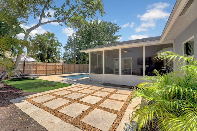18428 Alydar Way, Boca Raton, FL 33496 - fenced backyard featuring a sunroom and a patio area