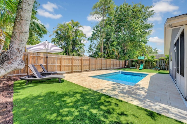 18428 Alydar Way, Boca Raton, FL 33496 - view of swimming pool with a playground and a patio