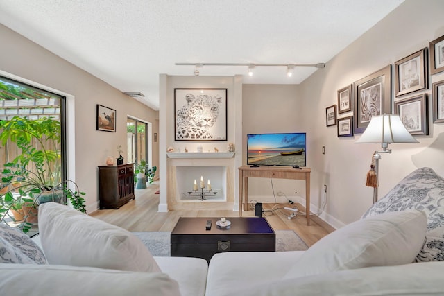 1518 15th Ln, Palm Beach Gardens, FL 33418 - living room with rail lighting and wood finished floors
