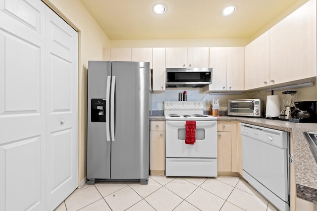 1801 N Flagler Dr Unit 931, West Palm Beach, FL 33407 - kitchen with stainless steel appliances, recessed lighting, and light tile patterned floors