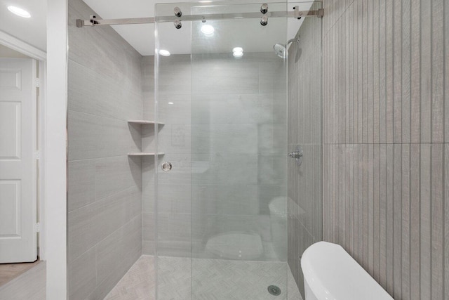 275 Palm Ave Unit B304, Jupiter, FL 33477 - bathroom featuring toilet and tiled shower