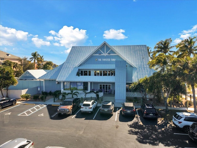 275 Palm Ave Unit B304, Jupiter, FL 33477 - view of building exterior with uncovered parking