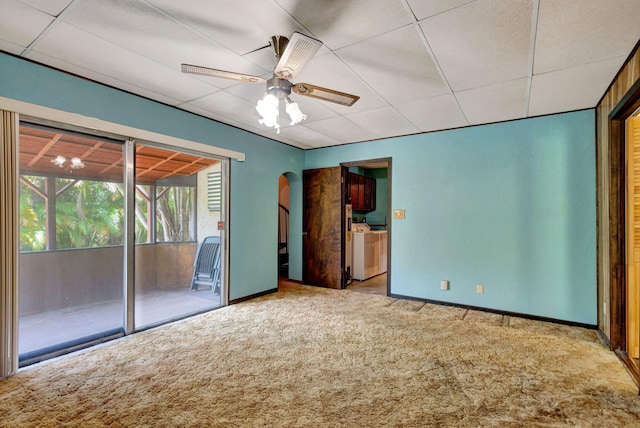 13705 Persimmon Blvd, The Acreage, FL 33411 - unfurnished bedroom featuring access to outside, carpet flooring, independent washer and dryer, baseboards, and arched walkways