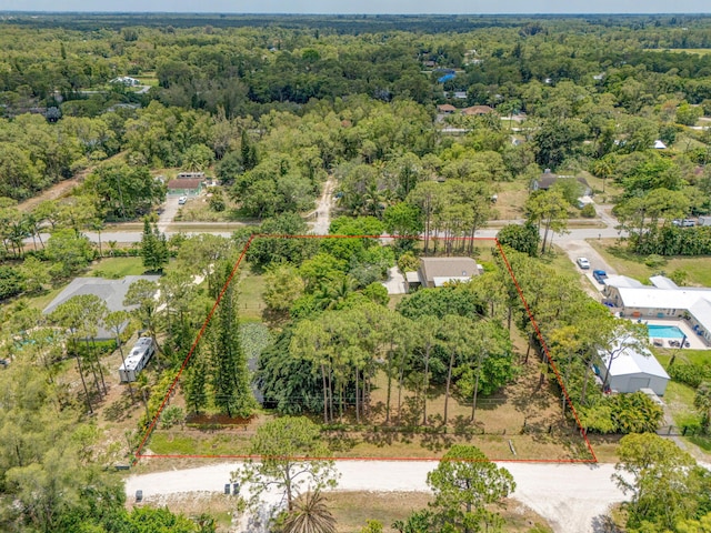 13705 Persimmon Blvd, The Acreage, FL 33411 - aerial view of property and surrounding area featuring property parcel outlined and a forest