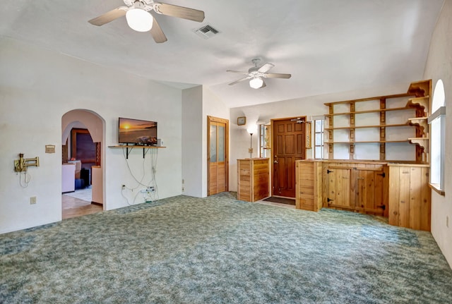 13705 Persimmon Blvd, The Acreage, FL 33411 - unfurnished living room with ceiling fan, carpet flooring, arched walkways, and lofted ceiling
