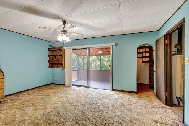 13705 Persimmon Blvd, The Acreage, FL 33411 - unfurnished bedroom with access to exterior, carpet floors, arched walkways, a paneled ceiling, and baseboards