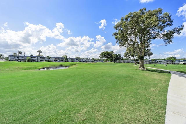521 Saxony K, Delray Beach, FL 33446 - view of property's community featuring view of golf course, a lawn, and a water view