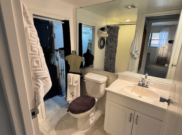521 Saxony K, Delray Beach, FL 33446 - bathroom with toilet, vanity, a shower with shower curtain, and tile patterned floors