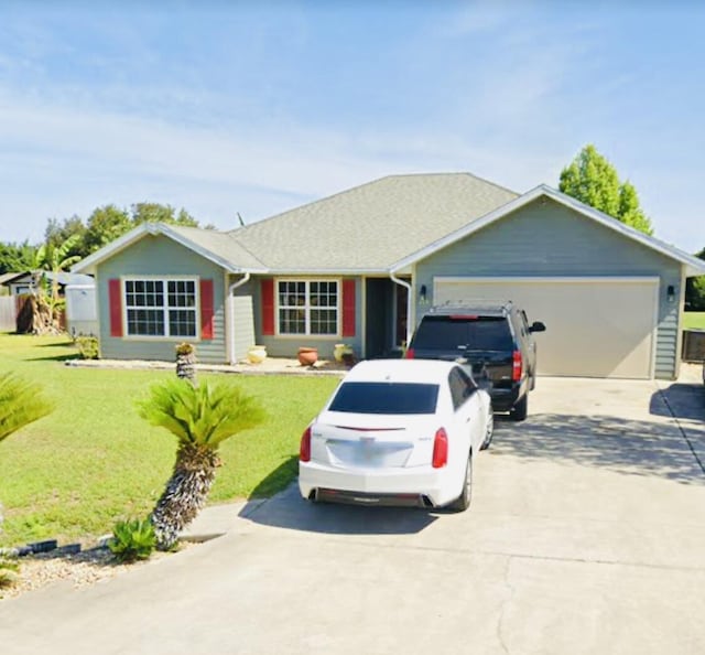 275 SE Gregory Gln, Lake City, FL 32025 - ranch-style house featuring concrete driveway, an attached garage, and a front yard