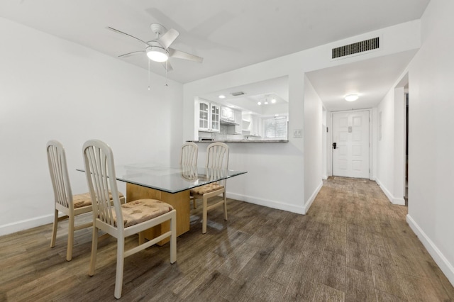 3186 Via Poinciana Unit 115, Lake Worth, FL 33467 - dining area featuring wood finished floors, ceiling fan, and baseboards