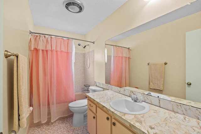 full bathroom with toilet, vanity, and shower / bath combo with shower curtain