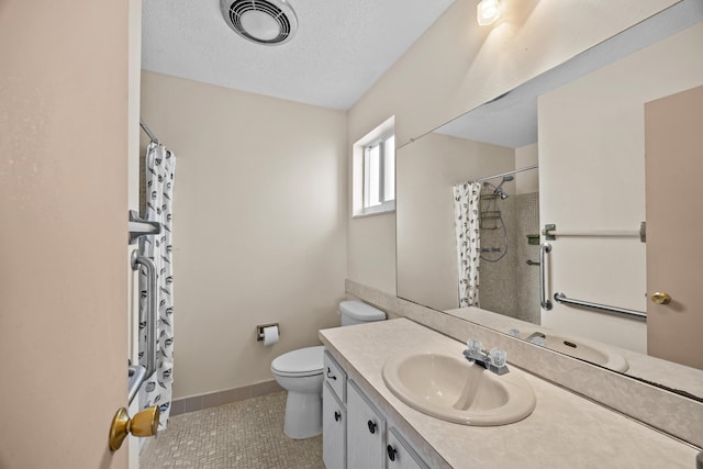 full bathroom with tile patterned floors, a shower with shower curtain, toilet, vanity, and a textured ceiling