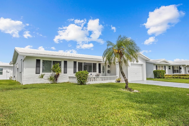 ranch-style home featuring an attached garage, driveway, a front lawn, and stucco siding