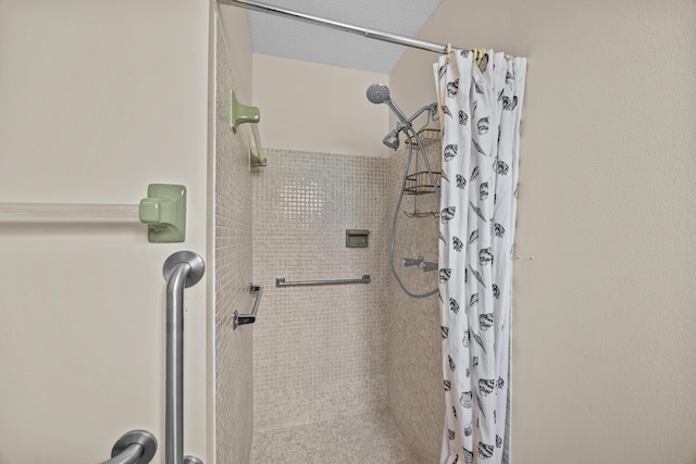 bathroom with a shower stall