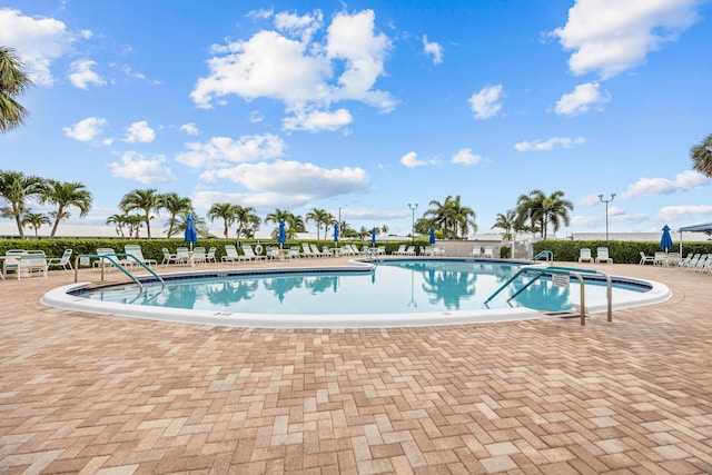 community pool featuring a patio area