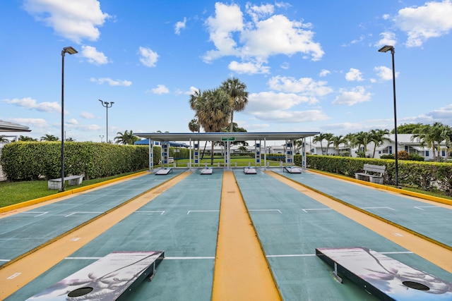 view of home's community featuring shuffleboard
