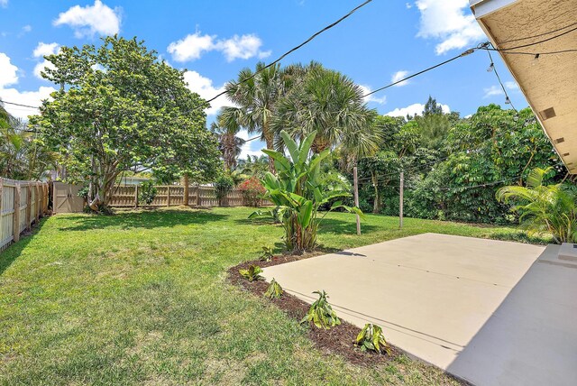2559 Conroy Dr, North Palm Beach, FL 33403 - view of yard featuring a patio