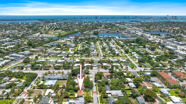 2559 Conroy Dr, North Palm Beach, FL 33403 - aerial view of property and surrounding area with a large body of water and nearby urban area