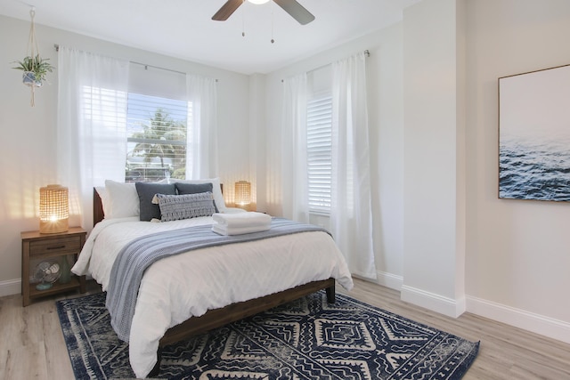 2559 Conroy Dr, North Palm Beach, FL 33403 - bedroom with light wood-type flooring, baseboards, and ceiling fan
