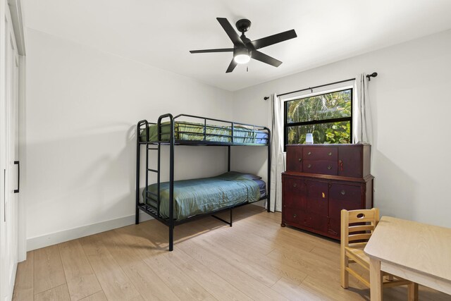 4972 S Kay St, Palm Beach Gardens, FL 33418 - bedroom with light wood-style flooring, ceiling fan, and baseboards