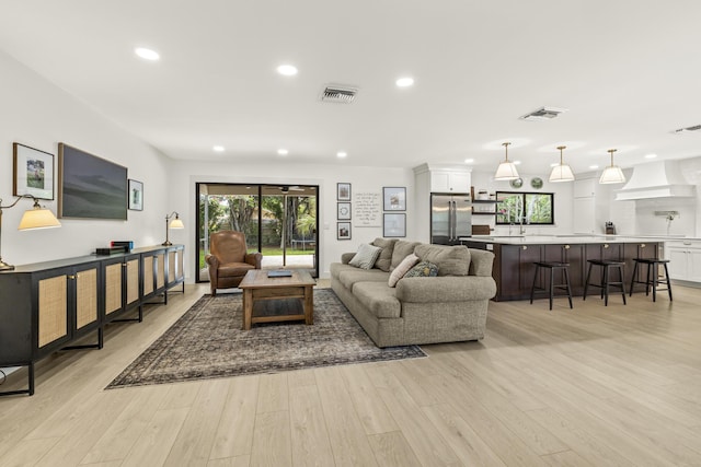 4972 S Kay St, Palm Beach Gardens, FL 33418 - living area with recessed lighting and light wood finished floors