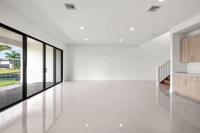8342 Crystal Downs Ave, Boca Raton, FL 33434 - empty room featuring recessed lighting, stairway, and light tile patterned floors
