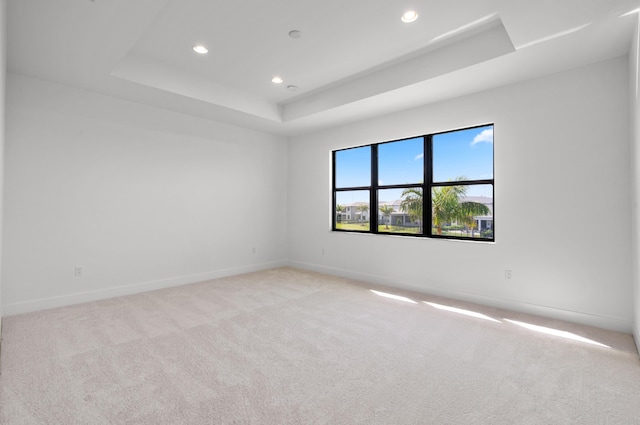 8342 Crystal Downs Ave, Boca Raton, FL 33434 - spare room with a tray ceiling, light carpet, recessed lighting, and baseboards