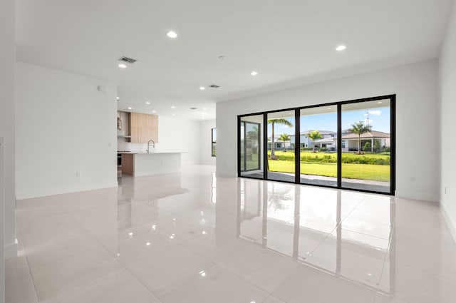 8342 Crystal Downs Ave, Boca Raton, FL 33434 - spare room featuring light tile patterned floors, recessed lighting, a sink, and baseboards