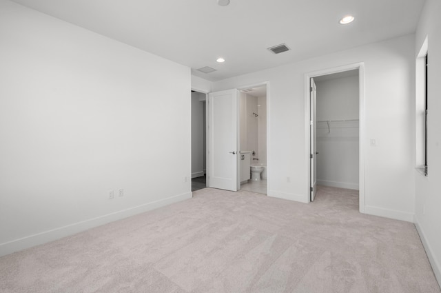 8342 Crystal Downs Ave, Boca Raton, FL 33434 - unfurnished bedroom with light colored carpet, baseboards, recessed lighting, a walk in closet, and connected bathroom