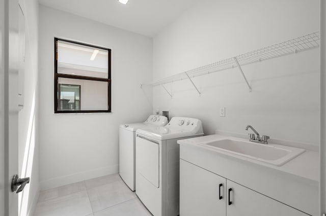 8342 Crystal Downs Ave, Boca Raton, FL 33434 - washroom with washing machine and dryer, baseboards, light tile patterned floors, and cabinet space