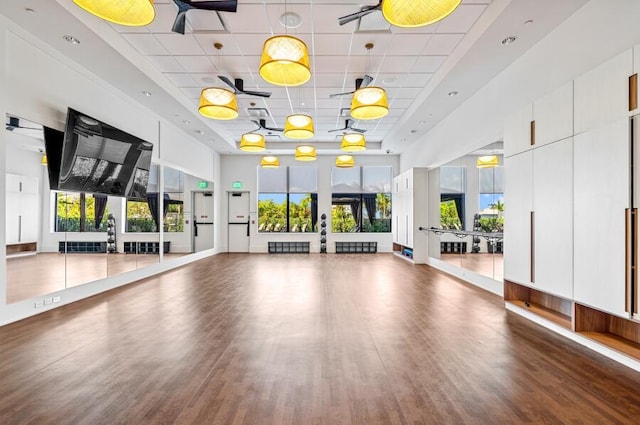 8342 Crystal Downs Ave, Boca Raton, FL 33434 - exercise room with a high ceiling, wood finished floors, and a paneled ceiling