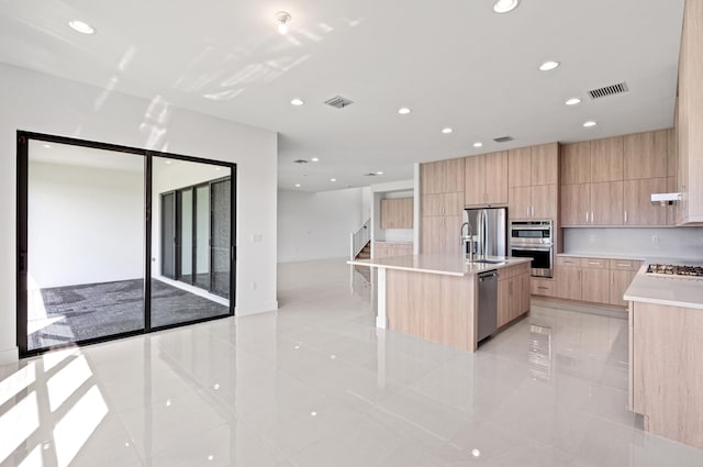 8342 Crystal Downs Ave, Boca Raton, FL 33434 - kitchen with modern cabinets, light brown cabinetry, light tile patterned flooring, stainless steel appliances, and light countertops