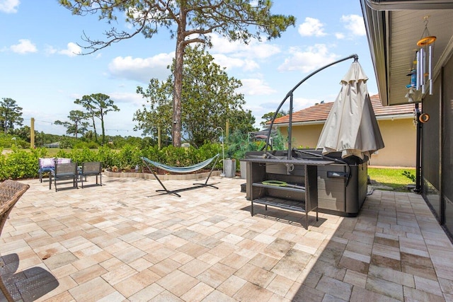 1345 SW Cedar Cv E, Port Saint Lucie, FL 34986 - view of patio / terrace with a hot tub