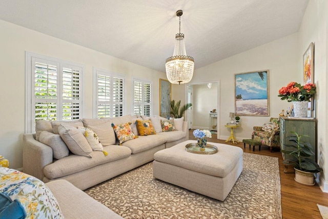 1345 SW Cedar Cv E, Port Saint Lucie, FL 34986 - living room featuring a chandelier, wood finished floors, and lofted ceiling