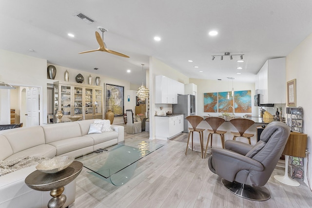 12092 Aprilia Dr, Boynton Beach, FL 33437 - living area featuring light wood-style flooring, recessed lighting, and ceiling fan