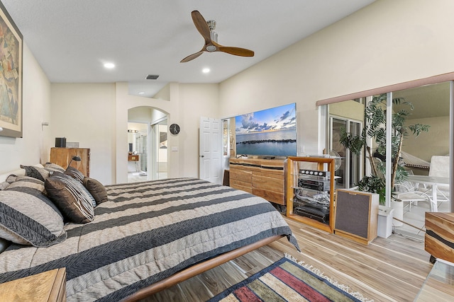 12092 Aprilia Dr, Boynton Beach, FL 33437 - bedroom with arched walkways, wood finished floors, recessed lighting, and ceiling fan