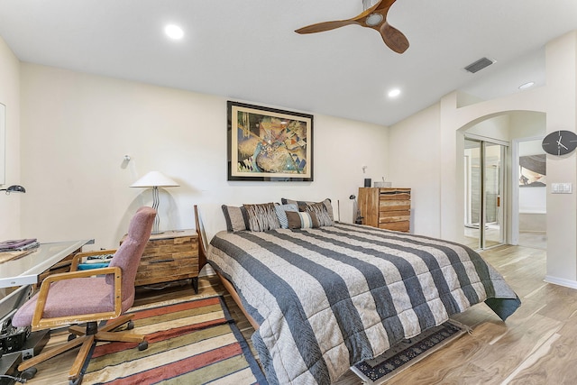 12092 Aprilia Dr, Boynton Beach, FL 33437 - bedroom featuring light wood-type flooring, arched walkways, recessed lighting, ceiling fan, and lofted ceiling
