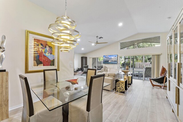 12092 Aprilia Dr, Boynton Beach, FL 33437 - dining room featuring light wood finished floors, a chandelier, a ceiling fan, high vaulted ceiling, and recessed lighting