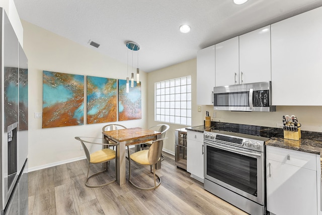 12092 Aprilia Dr, Boynton Beach, FL 33437 - kitchen featuring stainless steel appliances, light wood-type flooring, white cabinetry, recessed lighting, and baseboards