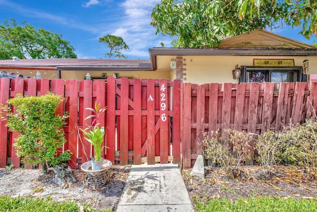 4296 Woodstock Dr Unit A, West Palm Beach, FL 33409 - view of front of house featuring stucco siding