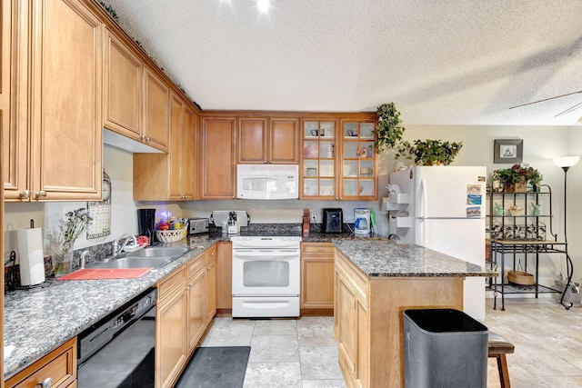 4296 Woodstock Dr Unit A, West Palm Beach, FL 33409 - kitchen with white appliances, a sink, a textured ceiling, a kitchen island, and glass insert cabinets