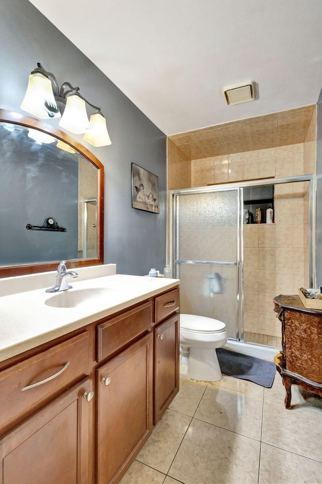 4296 Woodstock Dr Unit A, West Palm Beach, FL 33409 - bathroom with vanity, toilet, a stall shower, and tile patterned flooring