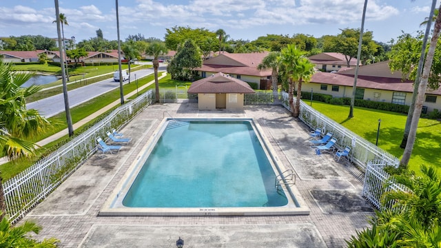 4296 Woodstock Dr Unit A, West Palm Beach, FL 33409 - community pool with a residential view and a patio
