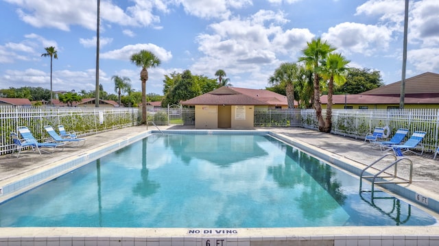4296 Woodstock Dr Unit A, West Palm Beach, FL 33409 - community pool with a patio