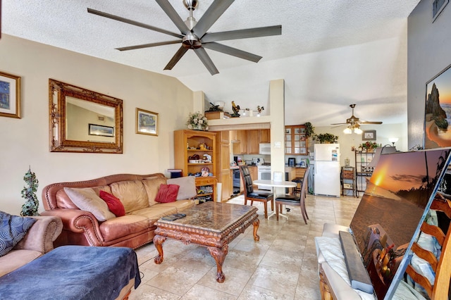 4296 Woodstock Dr Unit A, West Palm Beach, FL 33409 - living room featuring a ceiling fan, lofted ceiling, a textured ceiling, and light tile patterned flooring