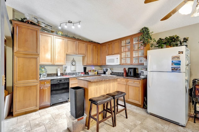 4296 Woodstock Dr Unit A, West Palm Beach, FL 33409 - kitchen featuring white appliances, a center island, a textured ceiling, glass insert cabinets, and ceiling fan