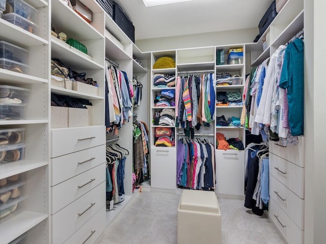 5082 Monroe Cir, Vero Beach, FL 32967 - walk in closet featuring light tile patterned floors